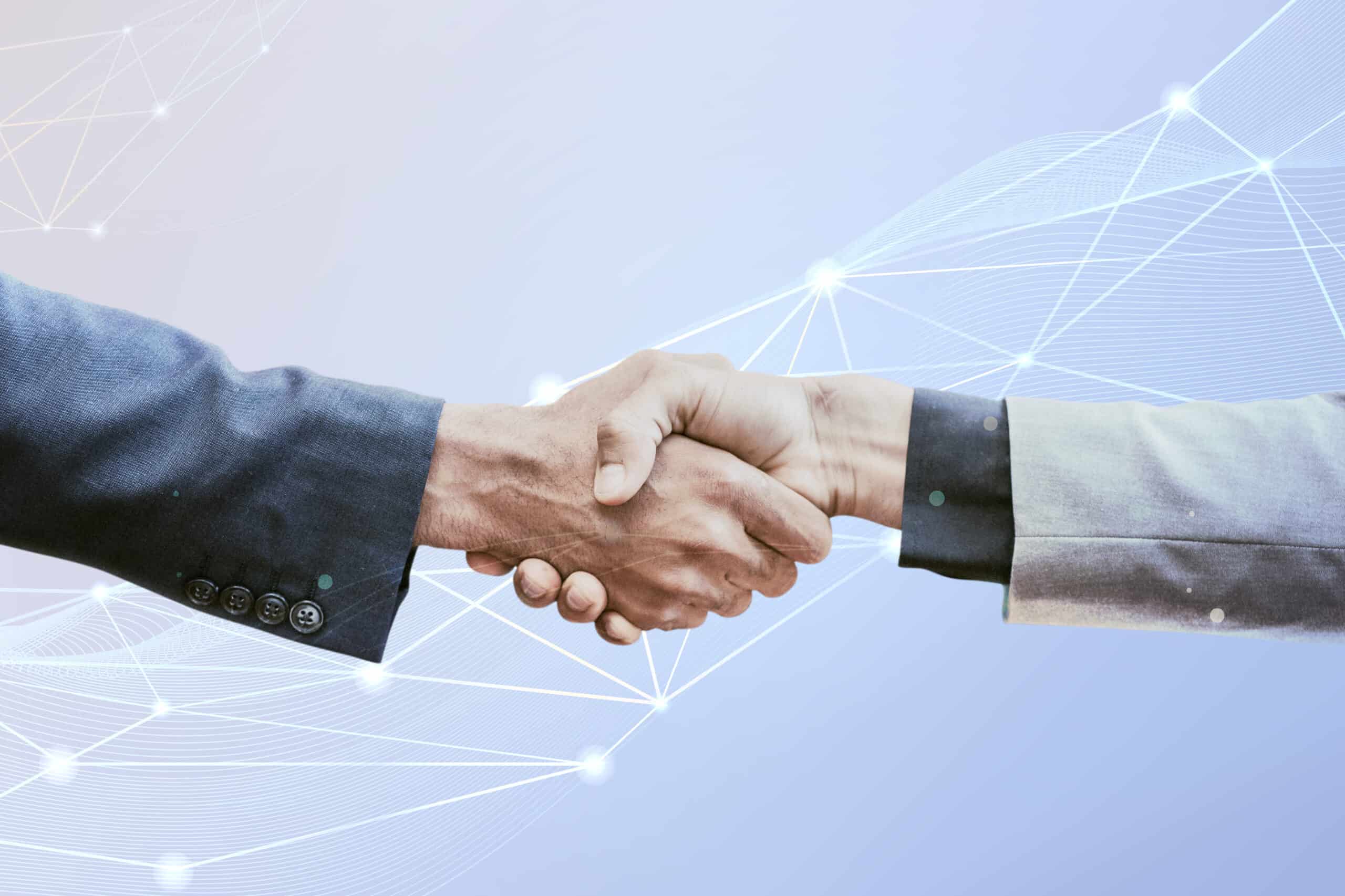 Two hands engaged in a handshake