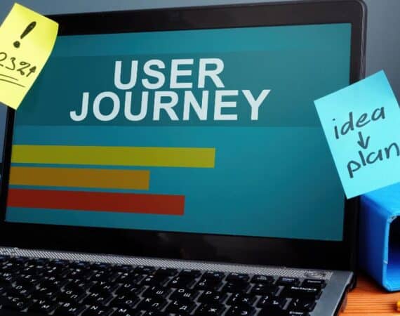 Laptop with graph and user journey